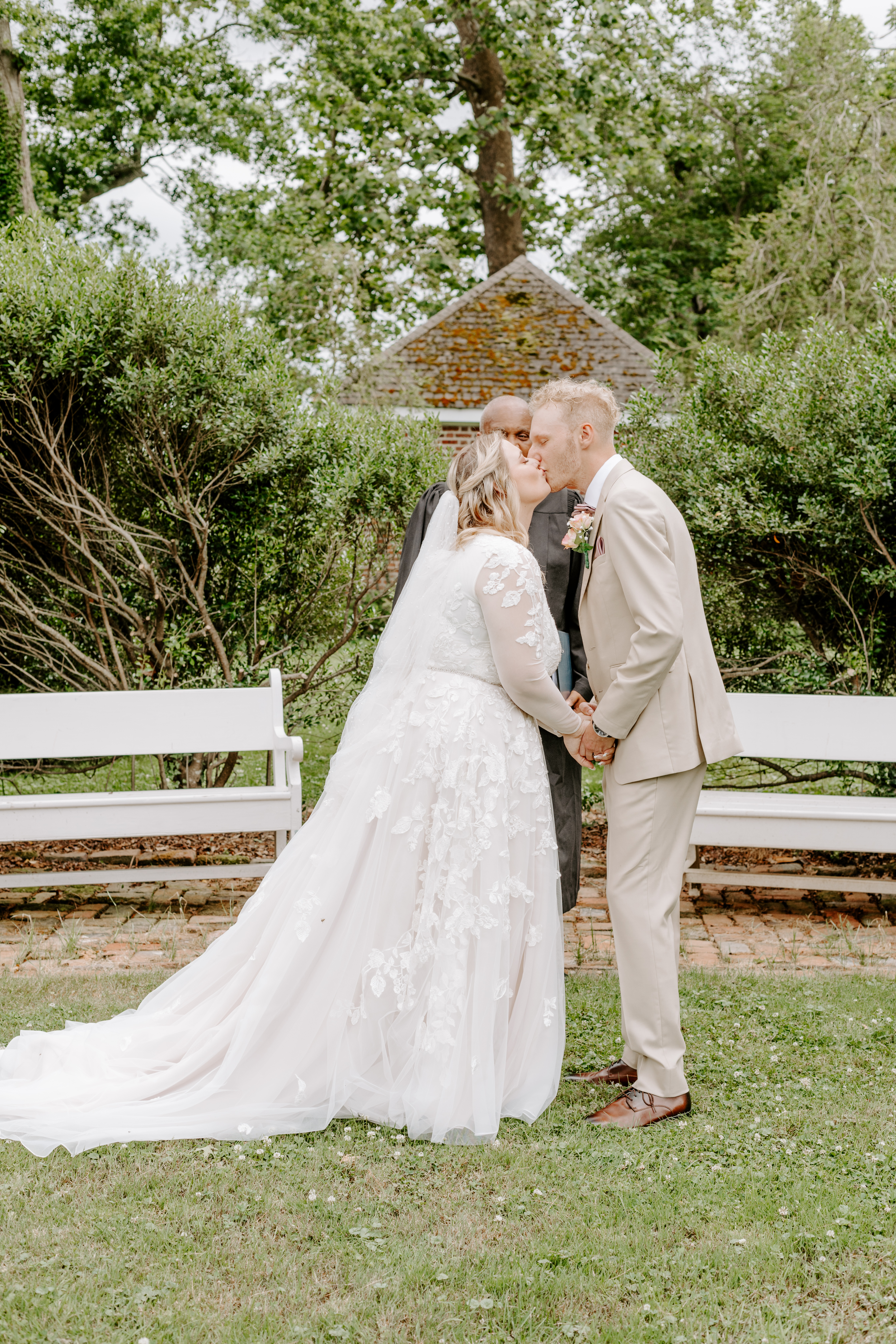 Wedding photograph of the first kiss at a spring wedding at Historic Odessa Delaware wedding venue