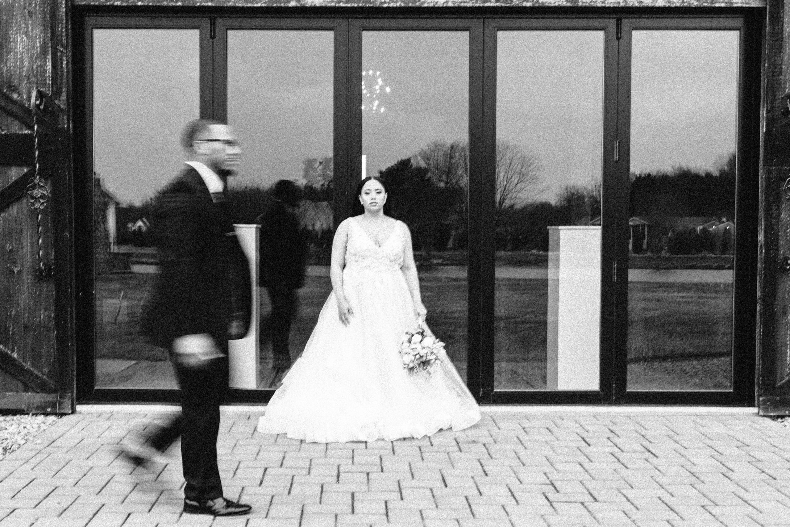 Bride and groom editorial style wedding portrait.