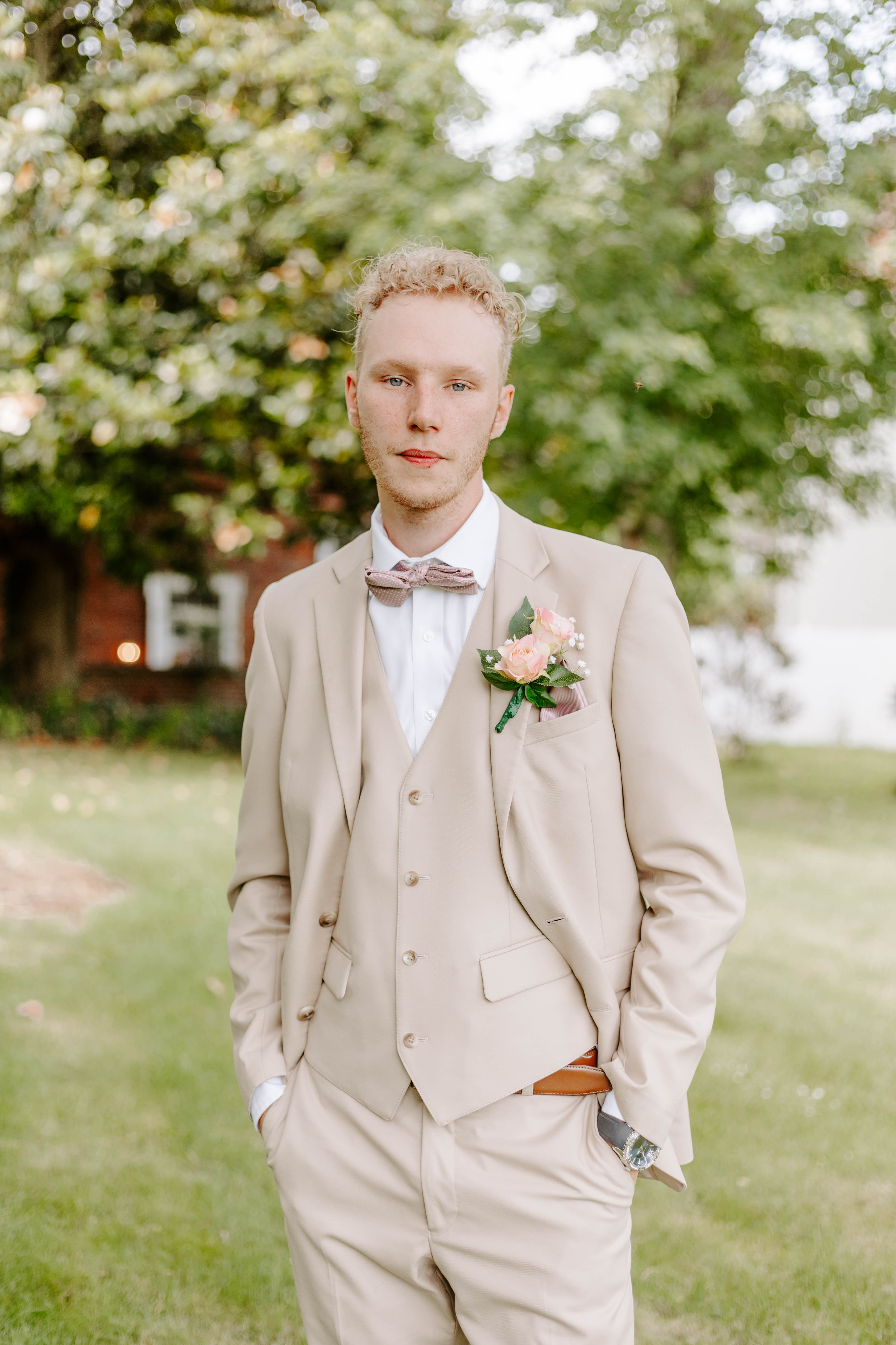 Individual groom portrait at spring wedding in Delaware  at Historic Odessa. Delaware wedding photographer Alli McGrath photographed this candid moment.
