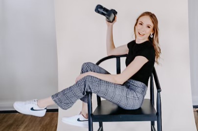 Delaware wedding photographer holding camera and smiling